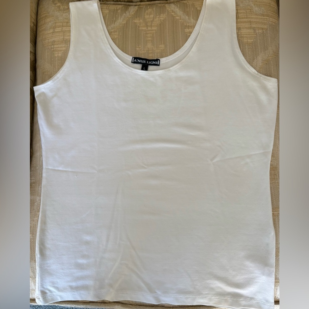 Versatile white shell that can be worn with anything.